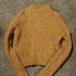 Yellow turtleneck sweater